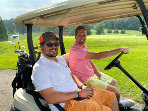 Guys in golf cart